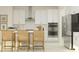 Modern kitchen with white cabinets and stainless steel appliances at 11729 71St E Ave, Palmetto, FL 34221