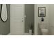 Small bathroom with toilet and a white door at 11555 E 71St Ter, Palmetto, FL 34221