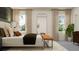 Bright bedroom with king-size bed and large mirror at 11555 E 71St Ter, Palmetto, FL 34221