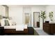 Bedroom with wood platform bed and large mirror at 11555 E 71St Ter, Palmetto, FL 34221
