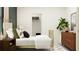 Bedroom with gold bed frame and wood dresser at 11555 E 71St Ter, Palmetto, FL 34221