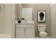 Small bathroom with white vanity, toilet, and shower at 11562 E 71St Ter, Palmetto, FL 34221