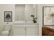 Modern bathroom with white vanity, toilet and a walk in shower at 11562 E 71St Ter, Palmetto, FL 34221