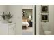 Clean bathroom with double vanity and view into bedroom at 11562 E 71St Ter, Palmetto, FL 34221