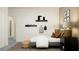 bedroom with bed, floating shelves, and backpack at 11562 E 71St Ter, Palmetto, FL 34221