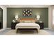 Serene bedroom with a plush bed and calming green accent wall at 11562 E 71St Ter, Palmetto, FL 34221
