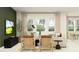 Relaxing living room featuring a sectional sofa and large windows at 11562 E 71St Ter, Palmetto, FL 34221
