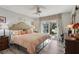 King-size bedroom with private access to backyard patio at 11911 Shadow Run Blvd, Riverview, FL 33569