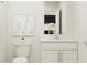 Simple bathroom with white vanity and toilet, plus a shower at 11915 Blue Diamond Trl, Parrish, FL 34219