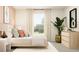 Bedroom with light wood bed frame and peach walls at 11915 Blue Diamond Trl, Parrish, FL 34219