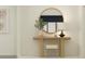 Stylish entryway with a round mirror and console table at 11915 Blue Diamond Trl, Parrish, FL 34219