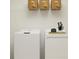 Functional laundry room with washer, dryer, and shelving at 11915 Blue Diamond Trl, Parrish, FL 34219
