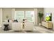 Bright and airy living room, featuring a sectional sofa and large windows at 11915 Blue Diamond Trl, Parrish, FL 34219