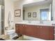 Modern bathroom with double vanity, shower, and toilet at 1208 E Kennedy Blvd # 729, Tampa, FL 33602