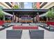 Outdoor seating area with fire pit and modern pergola at 1208 E Kennedy Blvd # 729, Tampa, FL 33602