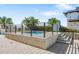 Relaxing community hot tub with surrounding patio and metal railing at 1208 E Kennedy Blvd # 729, Tampa, FL 33602