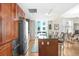 Modern kitchen featuring dark wood cabinets and a granite island at 1208 E Kennedy Blvd # 729, Tampa, FL 33602