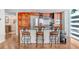 Modern kitchen with wood cabinets, granite counters, and island seating at 1208 E Kennedy Blvd # 729, Tampa, FL 33602