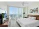 Spacious bedroom with hardwood floor, city view, and large bed at 1208 E Kennedy Blvd # 729, Tampa, FL 33602