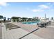 Relaxing pool area with multiple lounge chairs and tables at 1208 E Kennedy Blvd # 729, Tampa, FL 33602