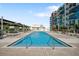 Resort-style pool and deck area with lounge chairs and cityscape views at 1208 E Kennedy Blvd # 729, Tampa, FL 33602