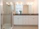 Bathroom with double vanity and large mirror at 12312 Bay Estuary Bnd, Riverview, FL 33579