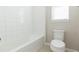 Bathroom with white tile and a bathtub at 12312 Bay Estuary Bnd, Riverview, FL 33579