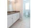 Bathroom with granite countertop and white cabinets at 12312 Bay Estuary Bnd, Riverview, FL 33579