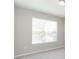 Spacious bedroom with large window and neutral decor at 12312 Bay Estuary Bnd, Riverview, FL 33579