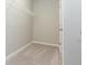 A spacious walk-in closet with wire shelving and neutral colored carpet at 12312 Bay Estuary Bnd, Riverview, FL 33579