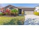 One-story home with a two-car garage and landscaped yard at 12312 Bay Estuary Bnd, Riverview, FL 33579
