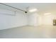 Empty garage with light grey flooring and extra storage space at 12312 Bay Estuary Bnd, Riverview, FL 33579