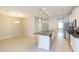 Open concept kitchen with island and stainless steel appliances at 12312 Bay Estuary Bnd, Riverview, FL 33579