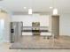 Kitchen boasts granite countertops and stainless steel appliances at 12312 Bay Estuary Bnd, Riverview, FL 33579
