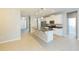Open concept kitchen with island and stainless steel appliances at 12312 Bay Estuary Bnd, Riverview, FL 33579