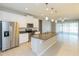 Open concept kitchen with island and stainless steel appliances at 12312 Bay Estuary Bnd, Riverview, FL 33579