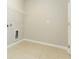 Laundry room with tile floor and built in shelving at 12312 Bay Estuary Bnd, Riverview, FL 33579