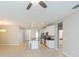 Open living room with ceiling fan and view into kitchen at 12312 Bay Estuary Bnd, Riverview, FL 33579
