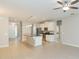 Open concept living room with kitchen and ceiling fan at 12312 Bay Estuary Bnd, Riverview, FL 33579