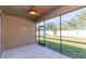 Relaxing screened patio with ceiling fan and access to backyard at 12312 Bay Estuary Bnd, Riverview, FL 33579