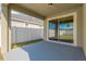 Covered patio with sliding glass doors and backyard access at 13122 Satin Lily Dr, Riverview, FL 33579