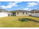 Spacious backyard with green grass and privacy fence at 13122 Satin Lily Dr, Riverview, FL 33579