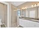 Double vanity bathroom with granite countertops and a walk-in shower at 13122 Satin Lily Dr, Riverview, FL 33579