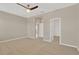Spacious bedroom with carpet, ceiling fan, and access to a walk-in closet at 13122 Satin Lily Dr, Riverview, FL 33579