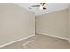 Well-lit bedroom with neutral walls and carpet floors at 13122 Satin Lily Dr, Riverview, FL 33579