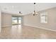 Spacious dining room with tile floors and sliding glass doors to backyard at 13122 Satin Lily Dr, Riverview, FL 33579