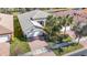 One-story house with a tiled roof and brick driveway, seen from above at 15724 Aurora Lake Cir, Wimauma, FL 33598