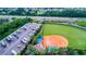 Aerial view of baseball field and RV parking at 15724 Aurora Lake Cir, Wimauma, FL 33598