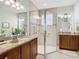Elegant bathroom with granite countertop, large shower, and modern fixtures at 15724 Aurora Lake Cir, Wimauma, FL 33598