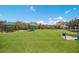 Dog park with shaded seating areas at 15724 Aurora Lake Cir, Wimauma, FL 33598
